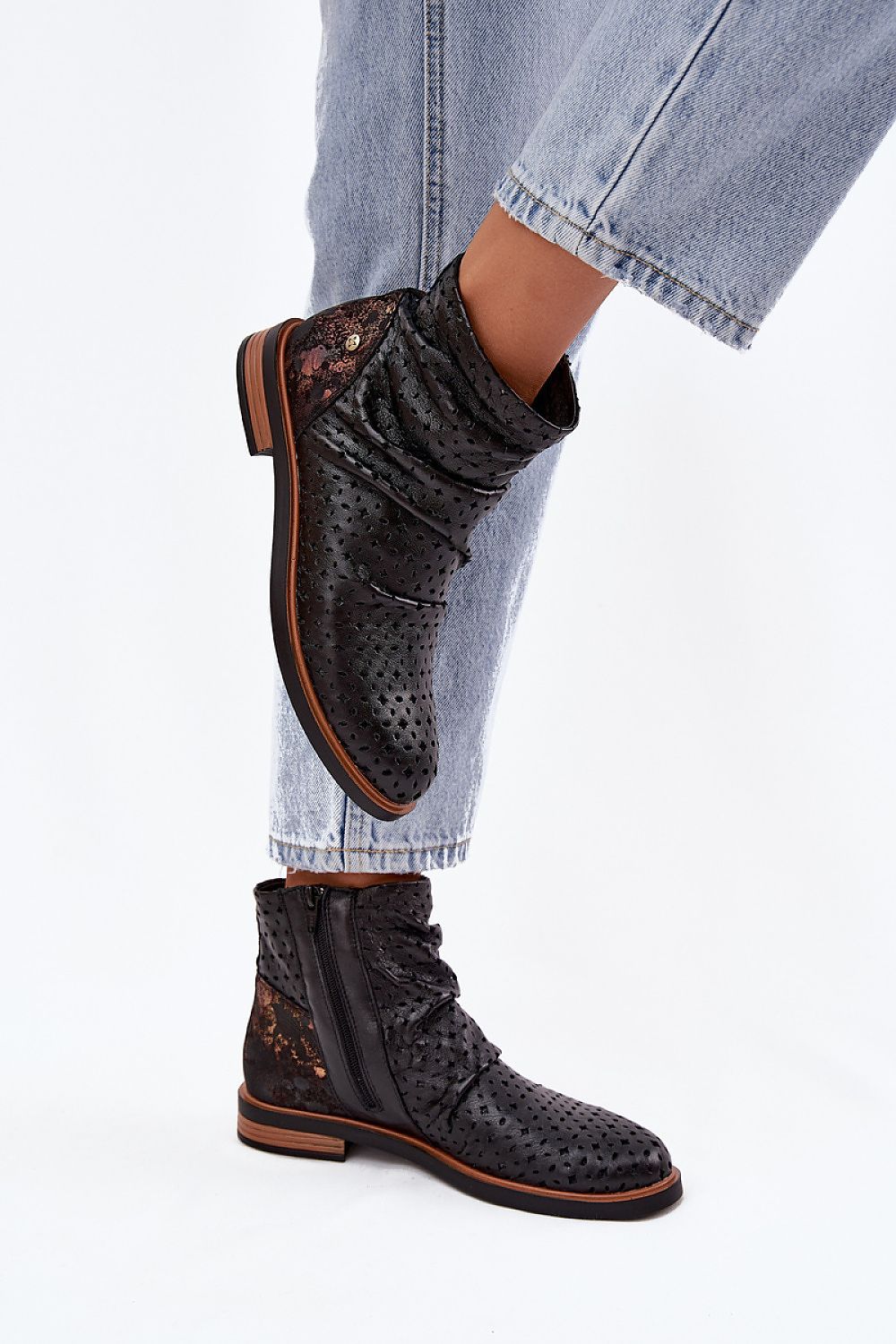 Sophisticated Maciejka women's ankle boots showcasing a refined openwork pattern, designed for a luxurious feel and classic feminine silhouette, available from Step in Style.