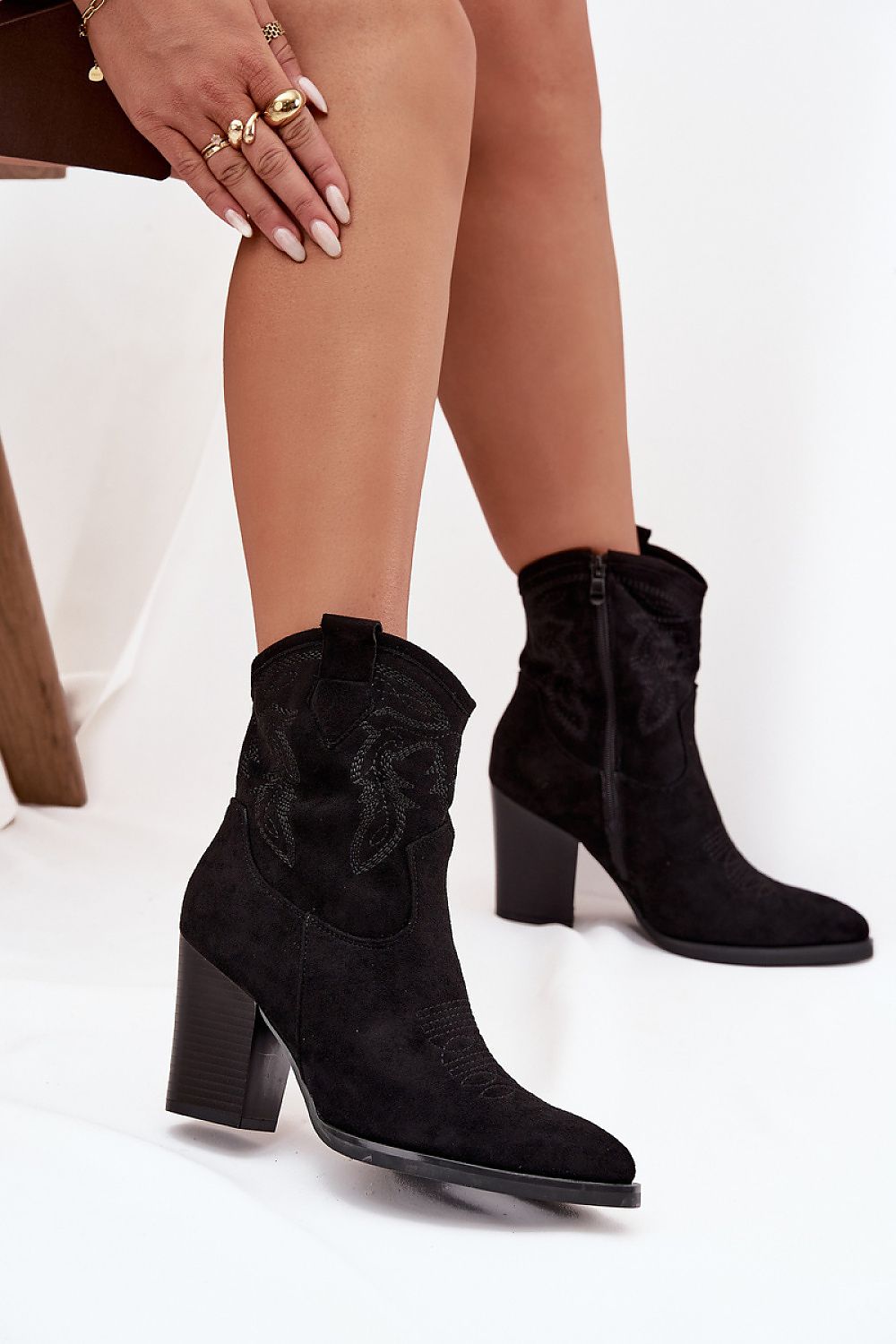Elegant eco suede cowboy ankle boots for women, designed by Step in Style, showcasing pointed toes and decorative stitching.