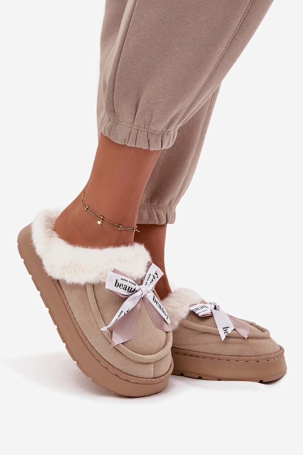 Stylish and cozy women's eco-suede slippers featuring a cute bow and thick sole by Step in Style, ideal for cooler days.