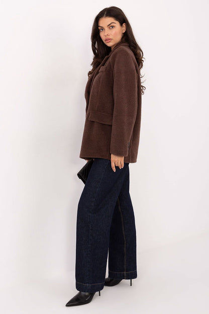 Close-up of the luxurious boucle texture of Rue Paris women's coat, showcasing the premium quality and comfort.