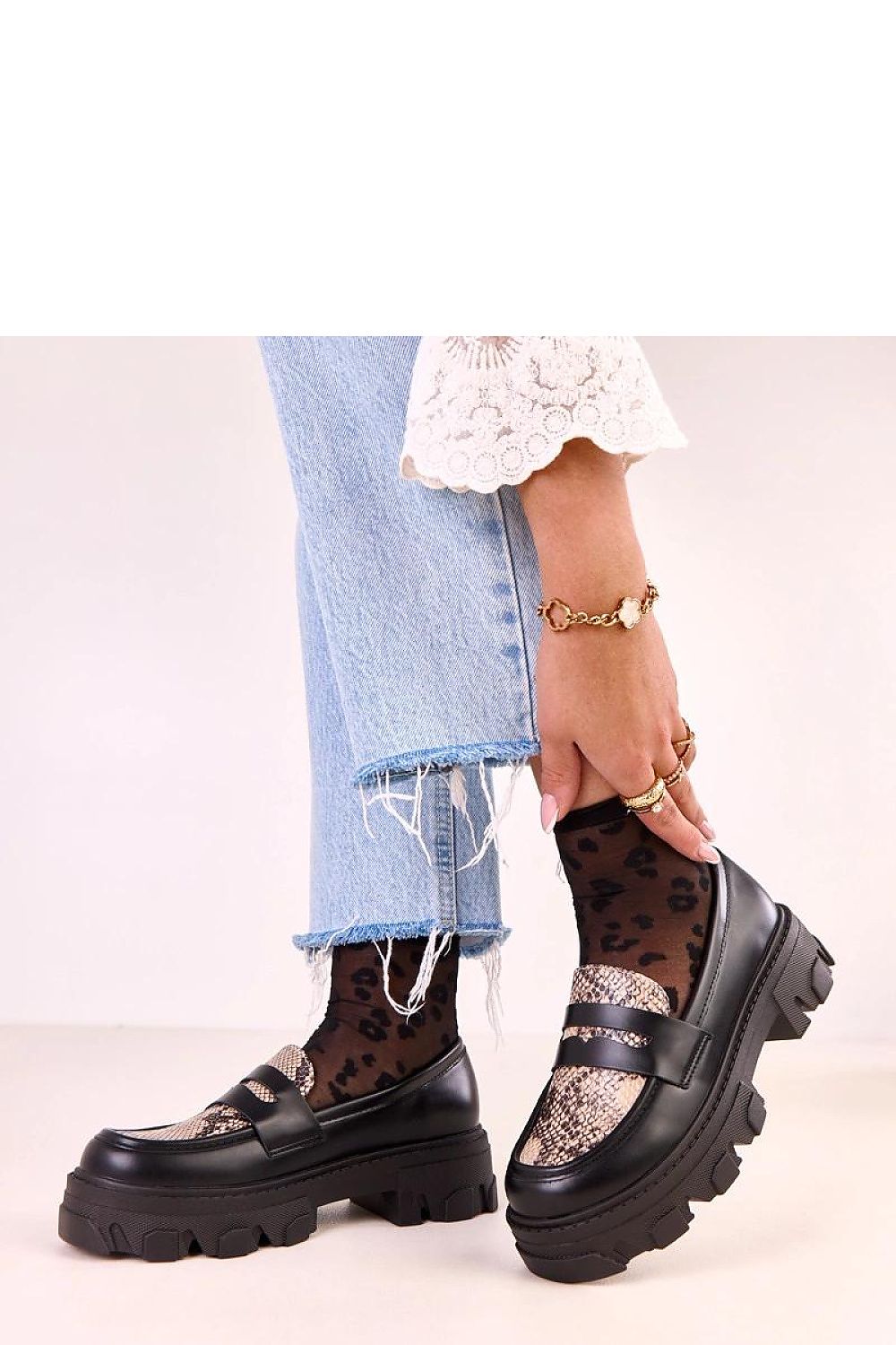 Chic Solea women's eco-leather moccasins with a delicate heel and attractive animal motif, crafted for comfort and sophistication.