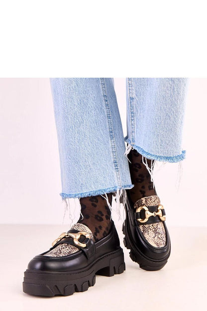 Close-up of Solea Elegant Eco-Leather Moccasins highlighting the sophisticated animal motif insert and premium artificial leather texture.