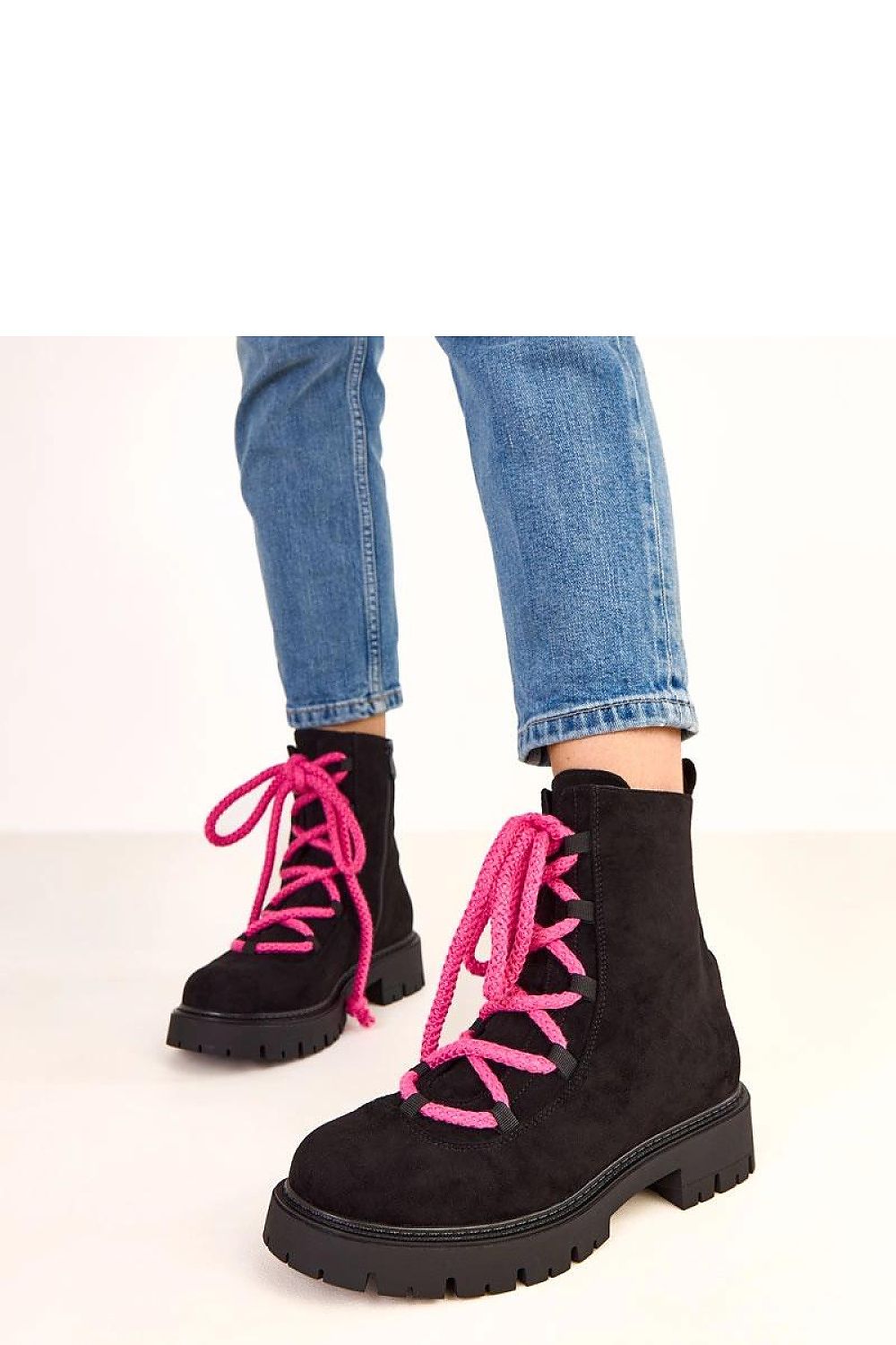 Close-up of Luxury Solea ankle boots highlighting the soft fabric insole and insulated interior for warmth, embodying elegance and comfort.