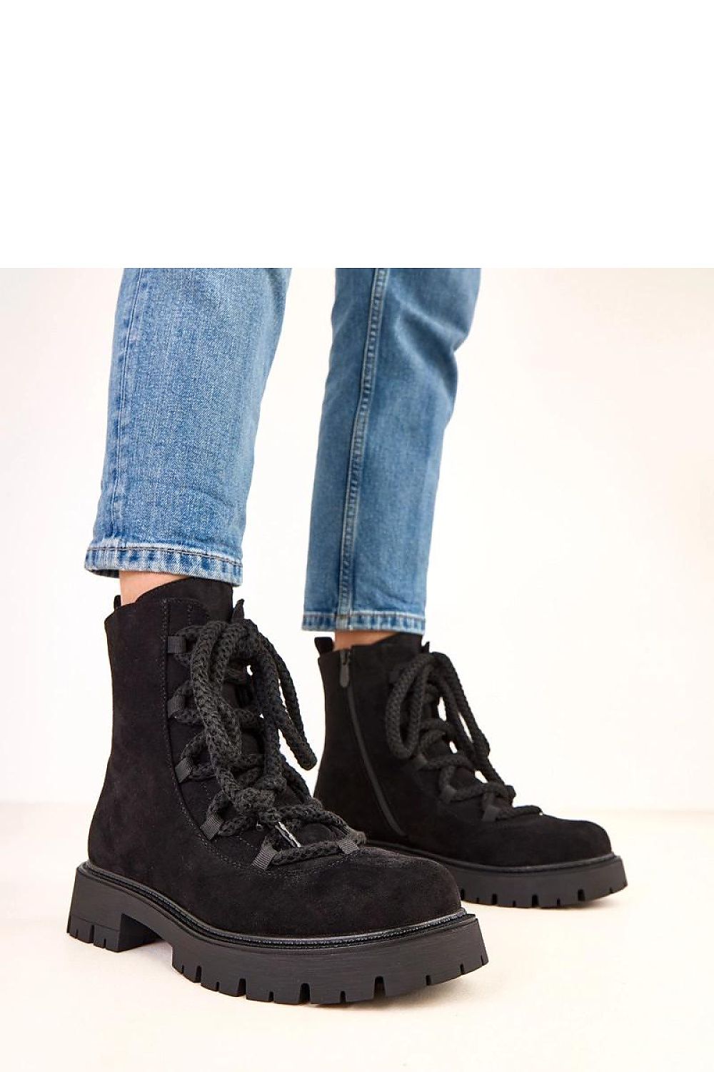 Luxury Solea ankle boots made from eco-friendly suede leather, featuring a stylish high cut and elegant design with a practical side zipper.