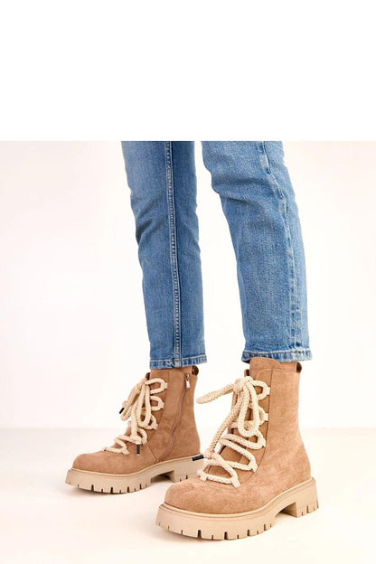 Side profile of the elegant Solea eco-friendly suede ankle boots, demonstrating the round toe design and refined 15 cm height that highlights the ankle beautifully.