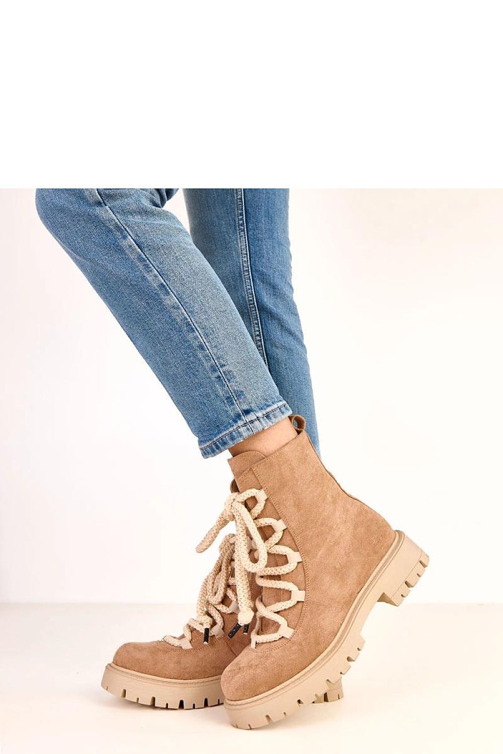 Close-up view of the luxurious Solea ankle boots showcasing the high-quality eco-friendly suede leather and sophisticated 4 cm heel, ideal for enhancing any outfit.