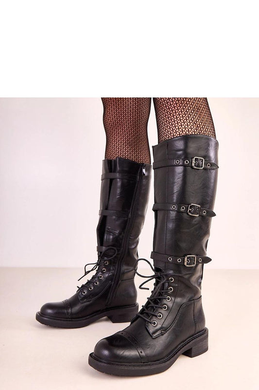 Elegant Solea Vintage Style Thigh-High Boots featuring decorative buckles and a stylish faux leather finish, perfect for a chic winter look.