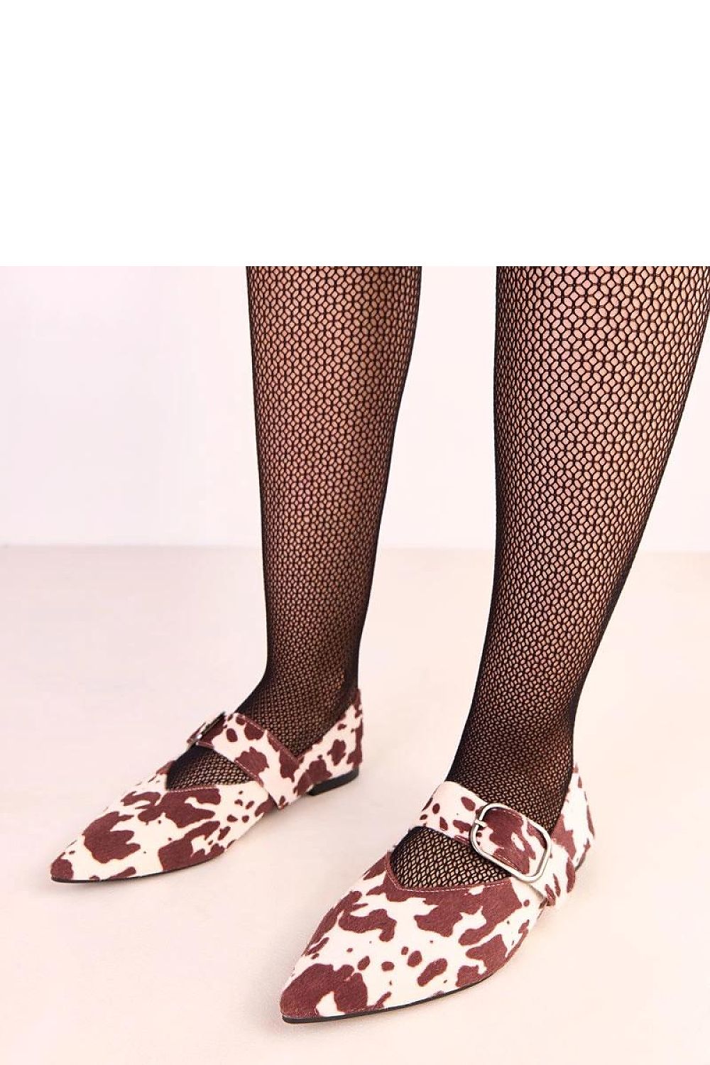 Solea elegant women's ballerina flats with bold buckle detail, crafted from eco leather, photographed against a chic backdrop to highlight the stylish design and pointed toe.