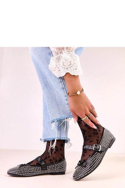 Close-up of Solea eco-leather ballet flats, highlighting the exquisite craftsmanship and feminine details of bows and studs.