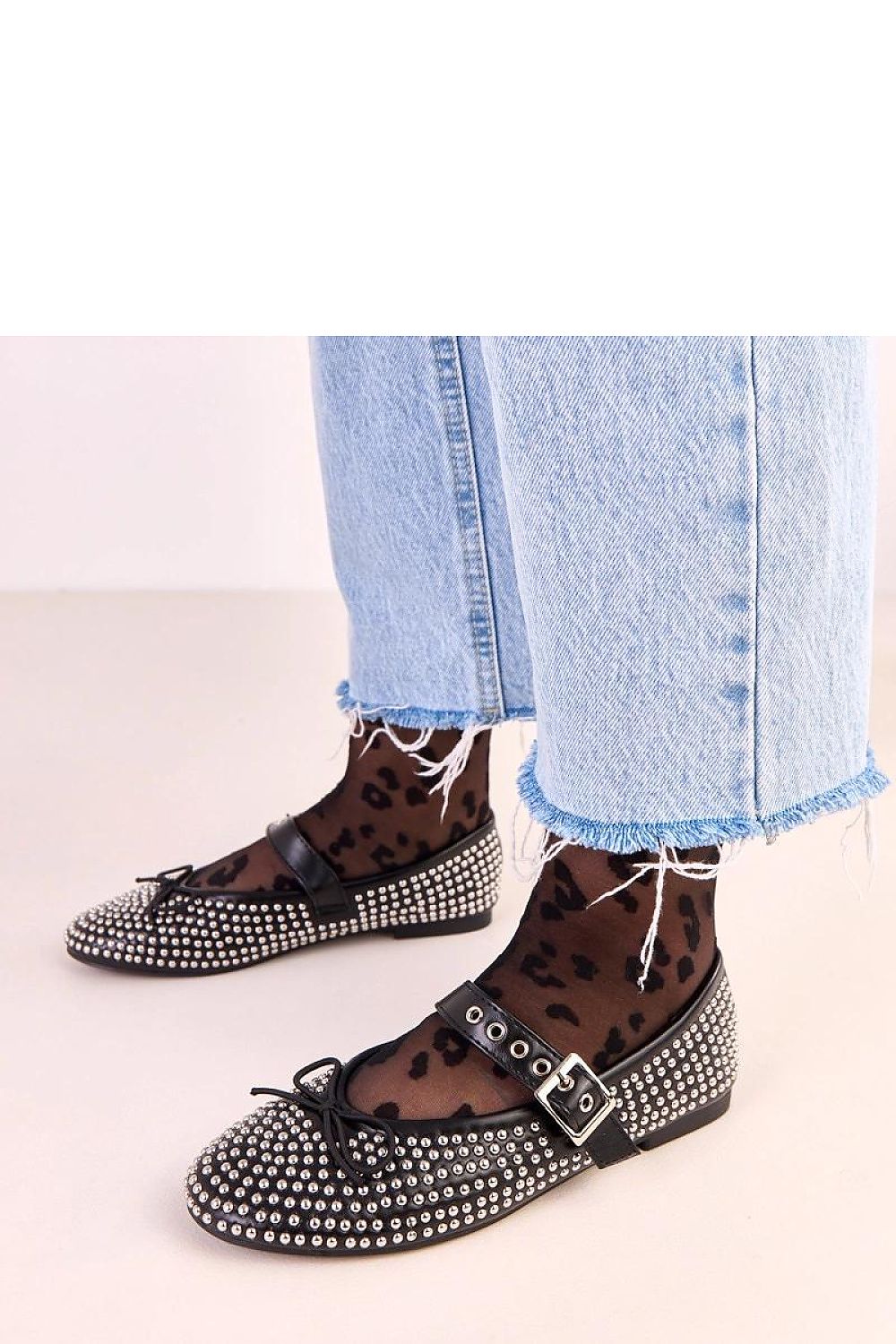 Versatile Solea eco-leather ballet flats with a modern touch of studs and bow, suitable for both casual and formal occasions.