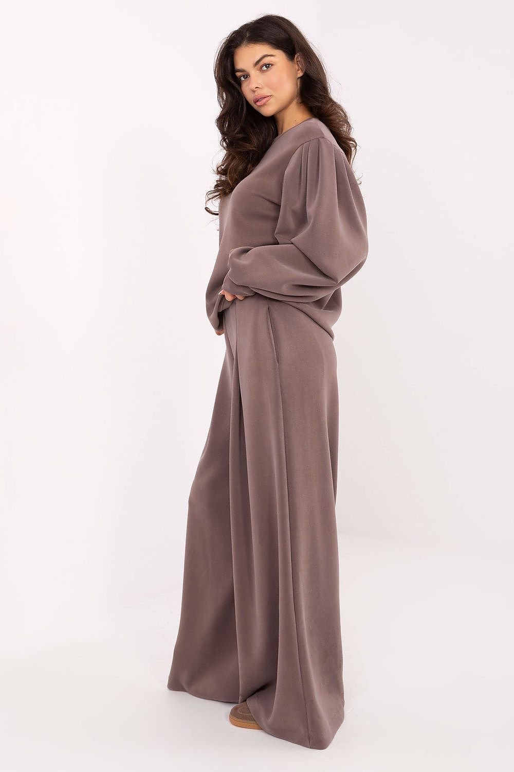 Luxury women's elegant blouse with puffy sleeves, crafted from a soft modal and viscose blend by Factory Price, showcasing feminine style and comfort.