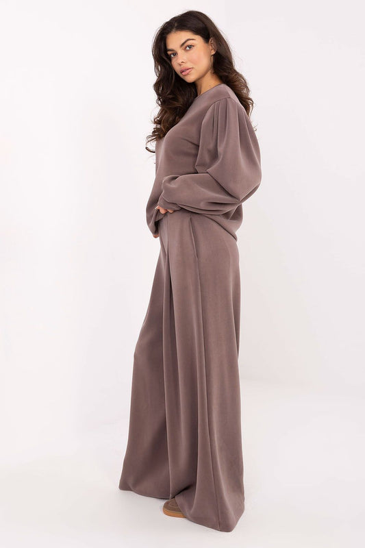 Luxury women's elegant blouse with puffy sleeves, crafted from a soft modal and viscose blend by Factory Price, showcasing feminine style and comfort.