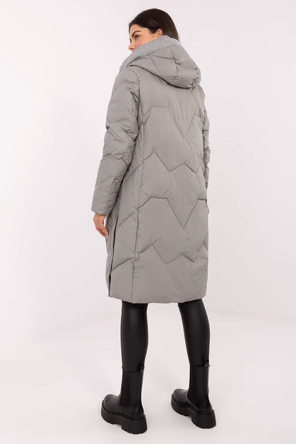 MBM Women's Long Down Jacket elegantly displayed with its adjustable hood and practical slip pockets, ideal for chic winter outings.
