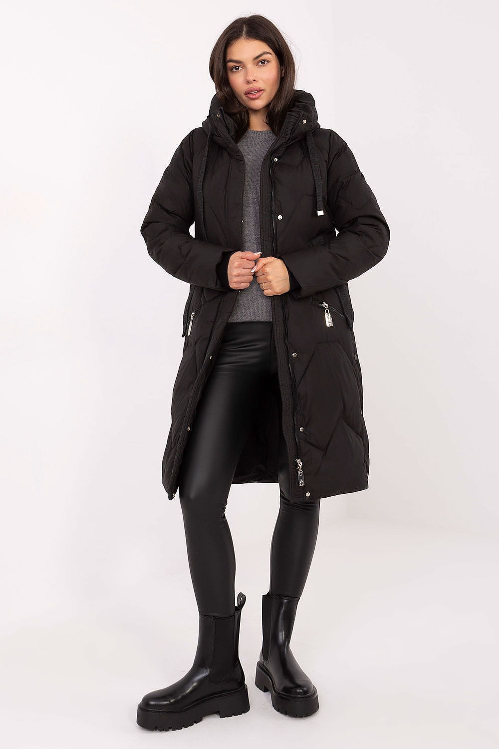 Female model wearing the MBM Women's Long Down Jacket, illustrating the flattering longer cut that enhances the silhouette.