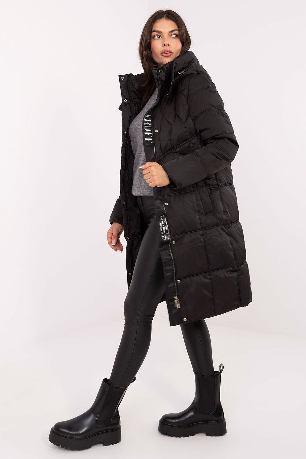 Model showcasing the MBM Women's Down Jacket with hood, elegantly styled for winter outings, reflecting both functionality and luxury.