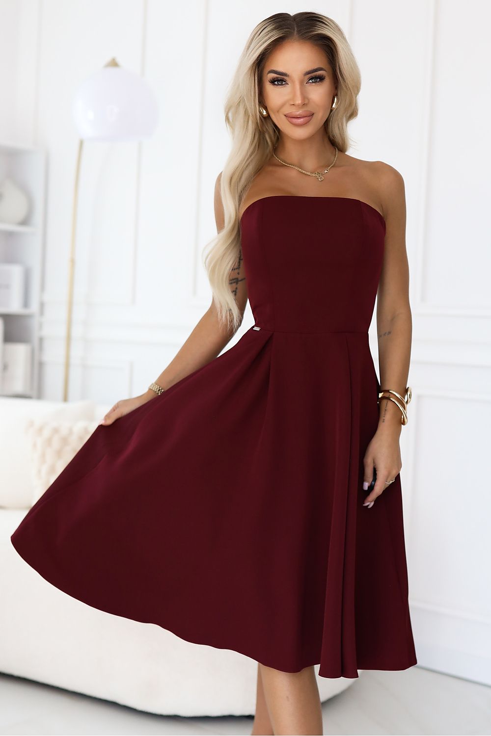 Elegant burgundy corset evening dress by Numoco, showcasing timeless elegance and modern design, perfect for prom or weddings.