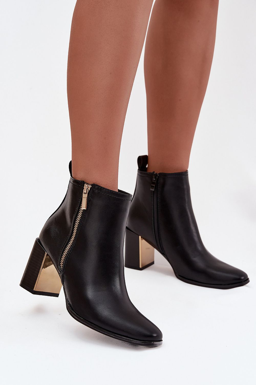Elegant women's eco leather ankle boots with a column heel and decorative zipper by Step in style, showcasing a stylish design perfect for both casual and formal occasions.