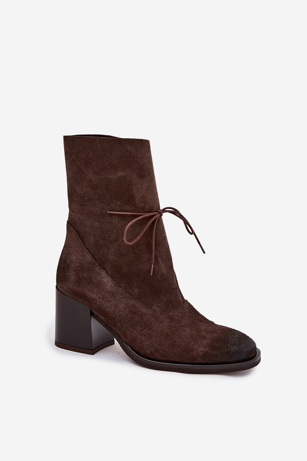 Close-up view of women's natural suede ankle boots by Step in style showcasing elegant design and adjustable lace, ideal for stylish comfort.