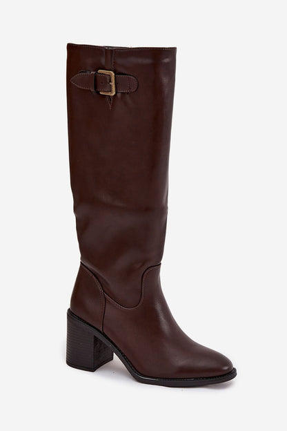 Close-up of Step in Style eco leather heel boots, showcasing the rounded toe design and decorative buckle for a luxurious touch.