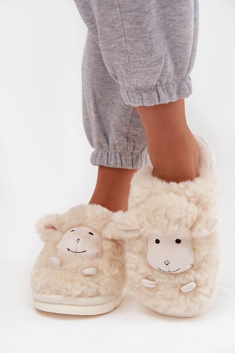Step in Style luxury women's fur slippers with a thick sole for stability, showcasing a cute sheep pattern, perfect for relaxation.