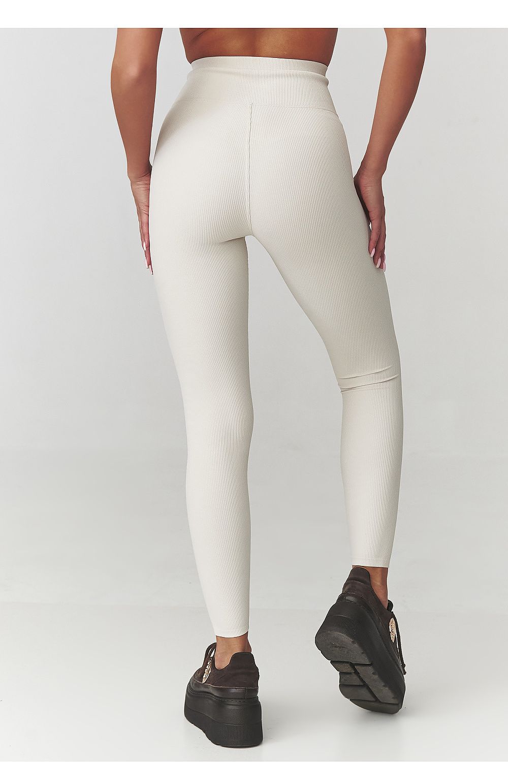 Close-up detail of Makadamia's luxury women's leggings showcasing the elastic, figure-hugging material and high waist design for ultimate comfort.