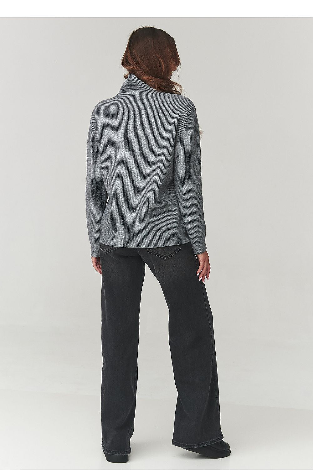 Stylish soft ribbed knit turtleneck sweater by Makadamia, showcased in a minimalist smart casual style, perfect for pairing with high-waisted pants.