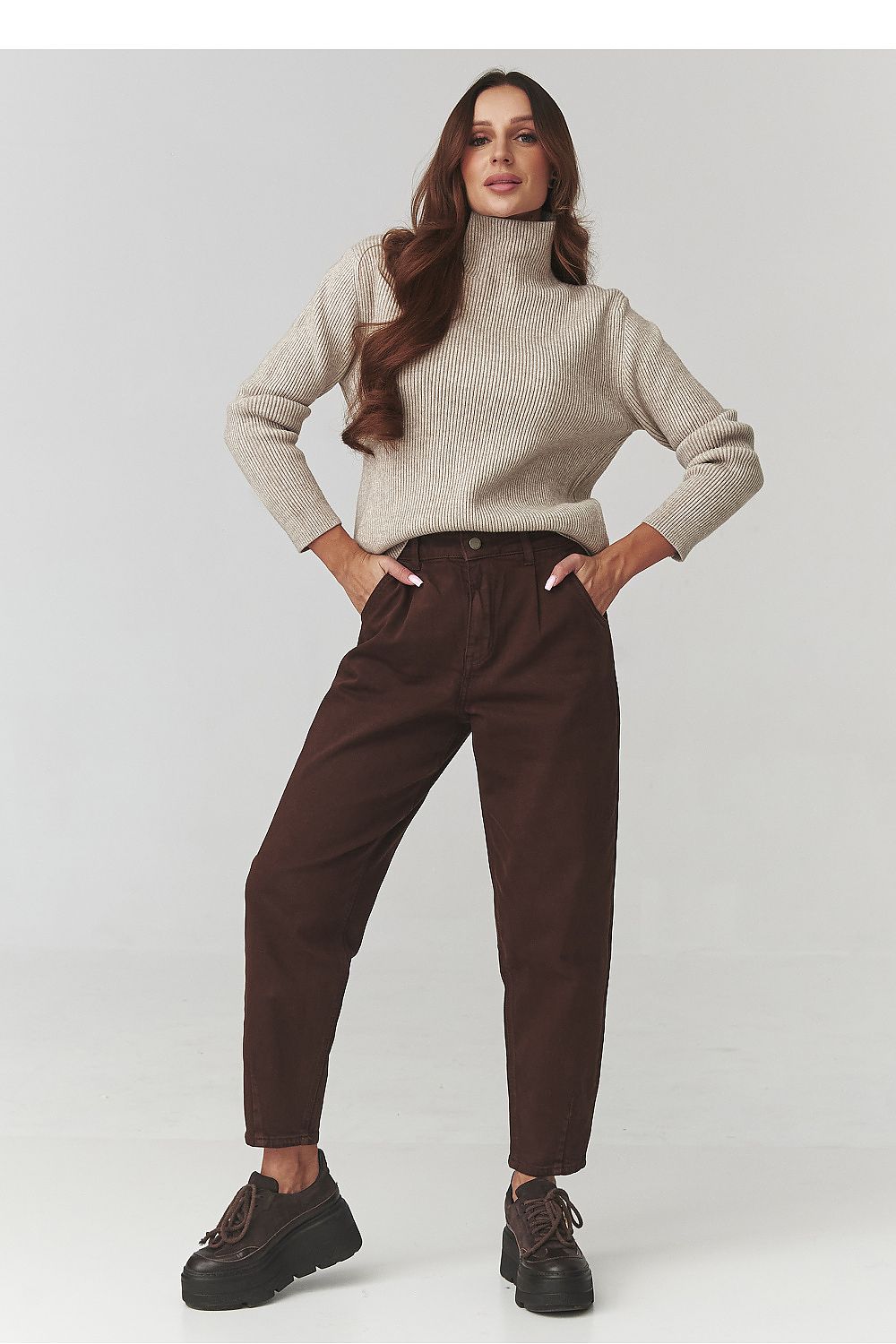 Full view of Makadamia Women's Turtleneck Sweater in soft ribbed knit, perfect for creating chic layered outfits.