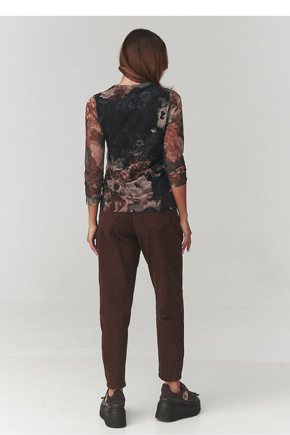 Versatile Makadamia floral turtleneck blouse, perfect for pairing with elegant trousers or jeans, demonstrating timeless style for various occasions.