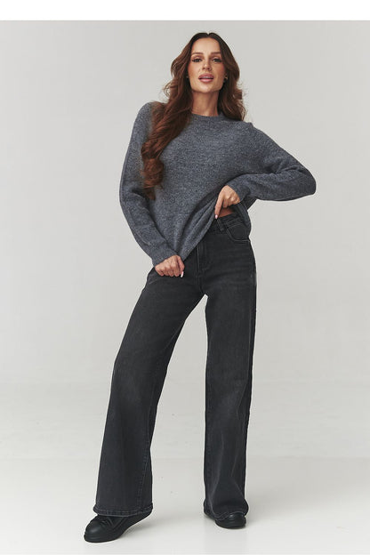 Luxurious Makadamia women's sweater showcasing a flattering loose fit and chic dropped shoulders, ideal for an elegant casual look.