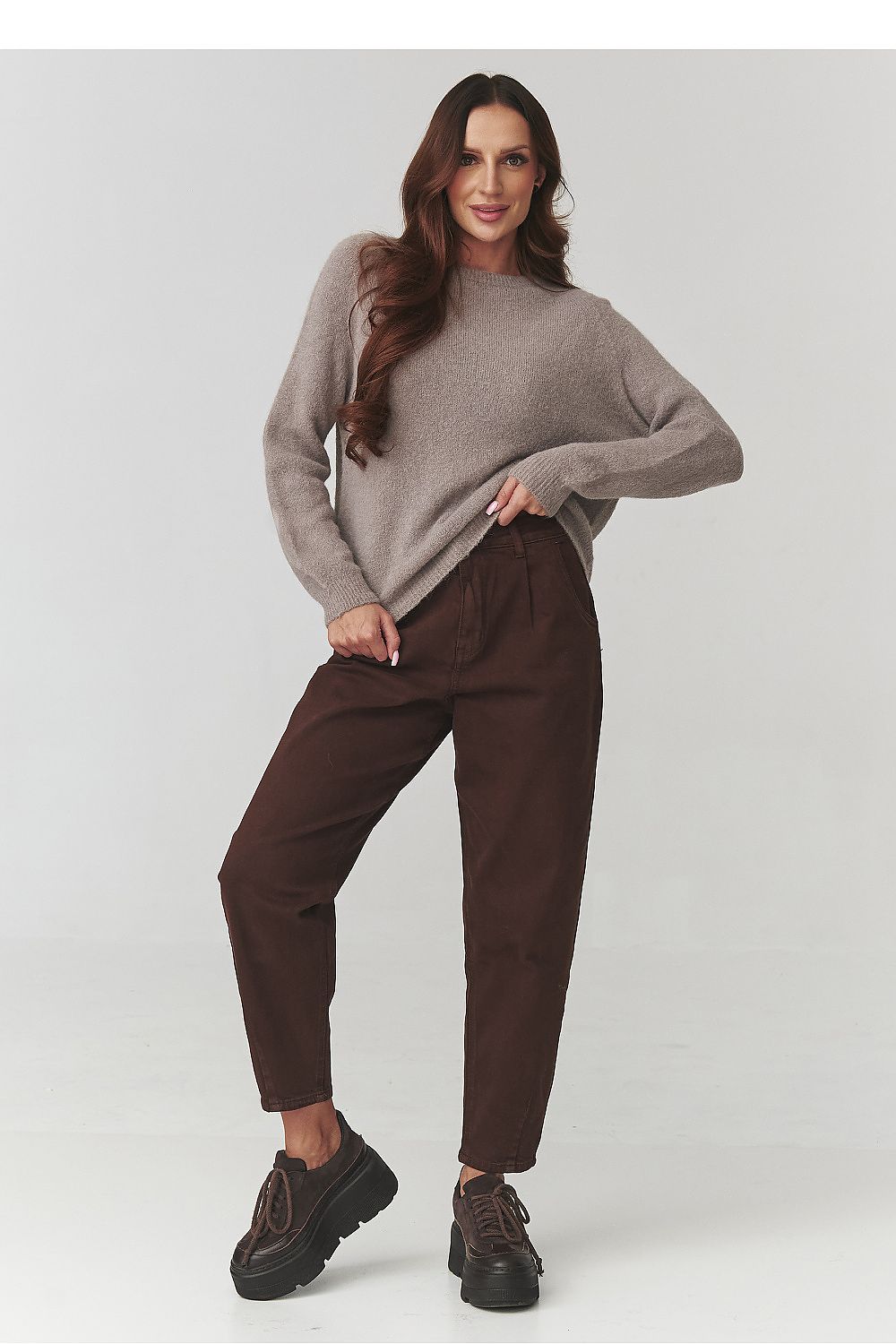 Sophisticated Makadamia women's jumper in rich, soft yarn, showcasing seamless Italian craftsmanship, perfect for pairing with jeans or a midi skirt.
