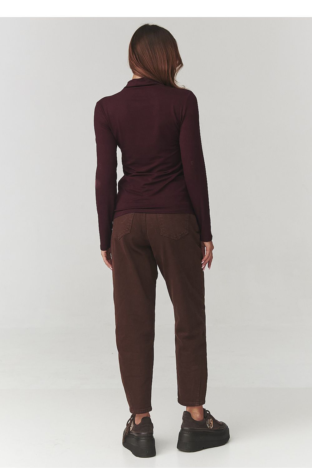 Stylish display of the Makadamia women's turtleneck blouse in various trendy colours, ideal for versatile fashion statements.