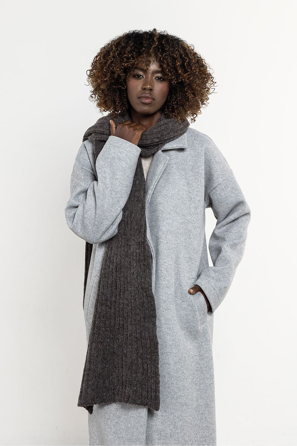 Versatile winter wrap, the kid mohair and wool long scarf from Awama, elegantly draped for a sophisticated look.