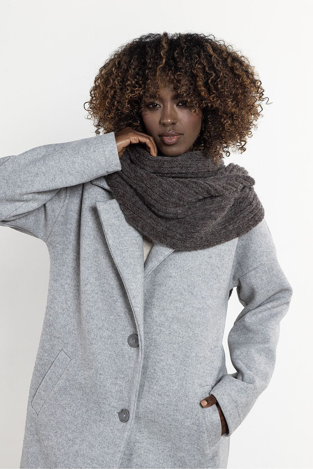 Warm and fluffy kid mohair and wool scarf from Awama, highlighting its ribbed design ideal for layering in cold weather.