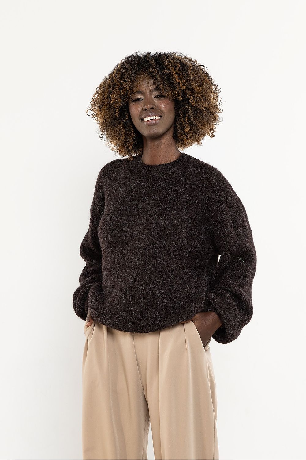 Detailed view of the Awama women's sweater, displaying the intricate knit pattern and high-quality fabric composition, suited for all seasons.
