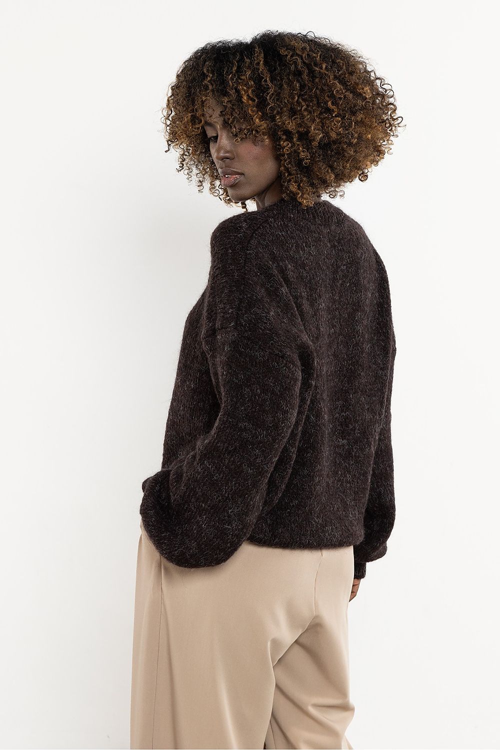 Model showcasing the Awama luxurious wool and kid mohair sweater, available in EU sizes S/M and L/XL, perfect for a chic wardrobe.