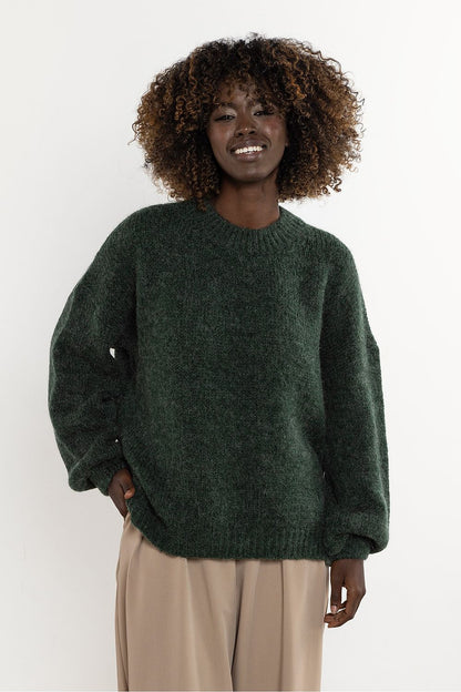 Sophisticated women's sweater by Awama, combining luxurious wool and kid mohair for a soft, warm experience.