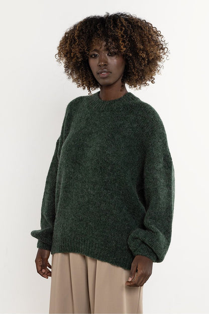 Luxurious women's sweater made from Awama wool and kid mohair, featuring long sleeves, in a stylish minimalist design.