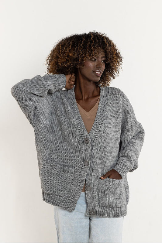 Awama's sophisticated wool blend cardigan displayed in a classic cut, tailored for both comfort and elegance, ideal for smart casual occasions.