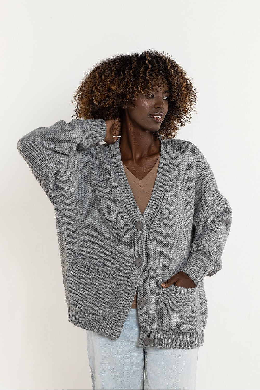 Detailing of the wonderfully soft fabric of Awama's V-Neck Cardigan, made with a blend of wool and acrylic for ultimate comfort.