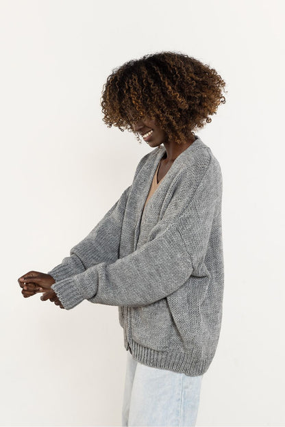 Elegant Wool Blend Cardigan by Awama featuring a stylish V-neck, button fastening, and practical pockets, perfect for a sophisticated autumn-winter wardrobe.