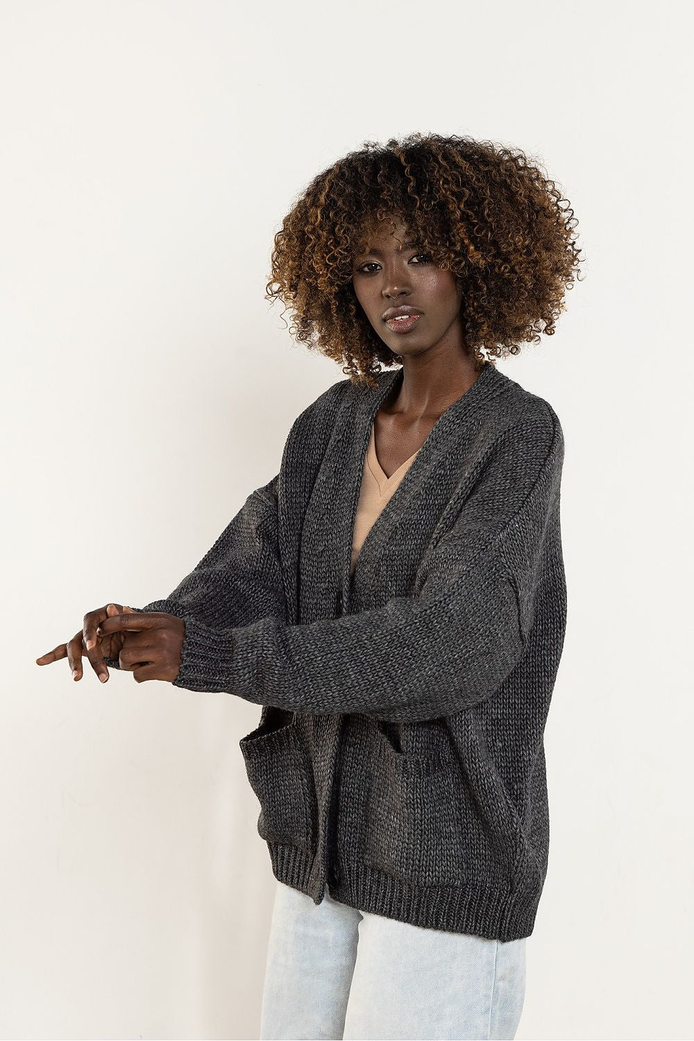 Luxurious wool blend cardigan for women by Awama, featuring a stylish V-neck and button closure, suitable for both casual and smart casual attire.