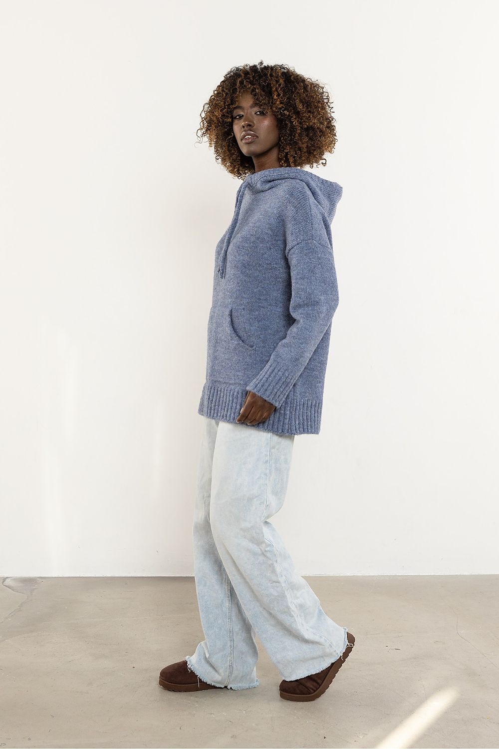 Close-up view of the luxurious wool fabric of the hooded sweater by Awama, highlighting its softness and comfort.