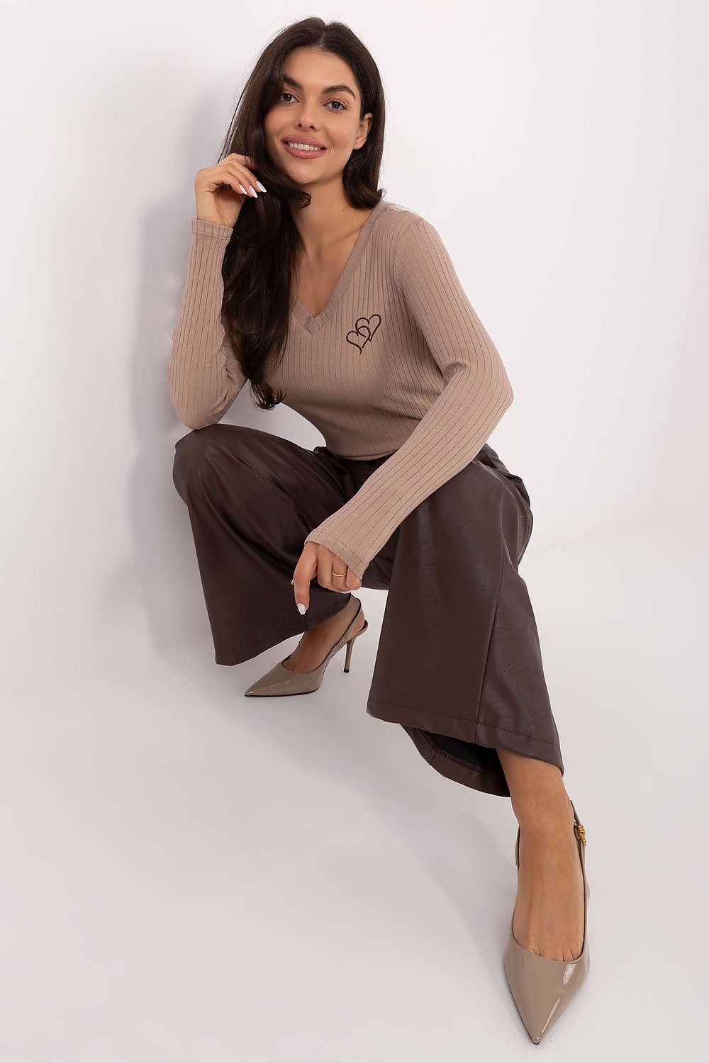 Close-up of stylish ribbed cotton blouse showcasing delicate heart embroidery, from Rue Paris, perfect for everyday elegance.