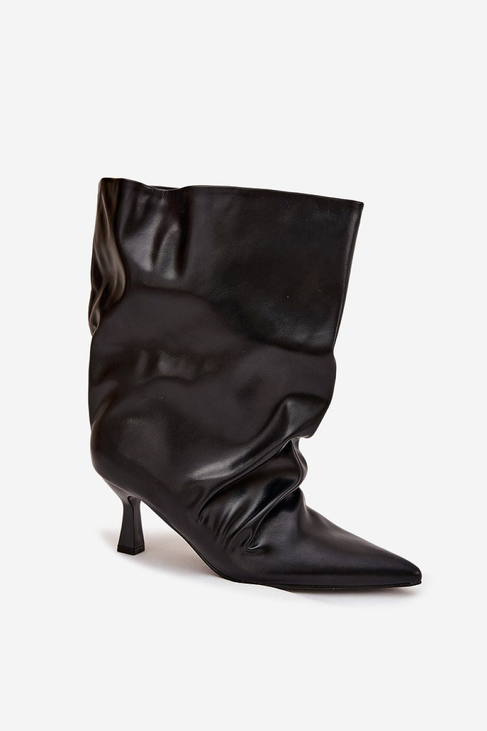 Close-up of luxurious eco-leather texture on women's ankle boots with a stylish slim heel from Step in Style.