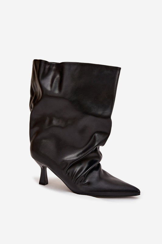 Close-up of luxurious eco-leather texture on women's ankle boots with a stylish slim heel from Step in Style.