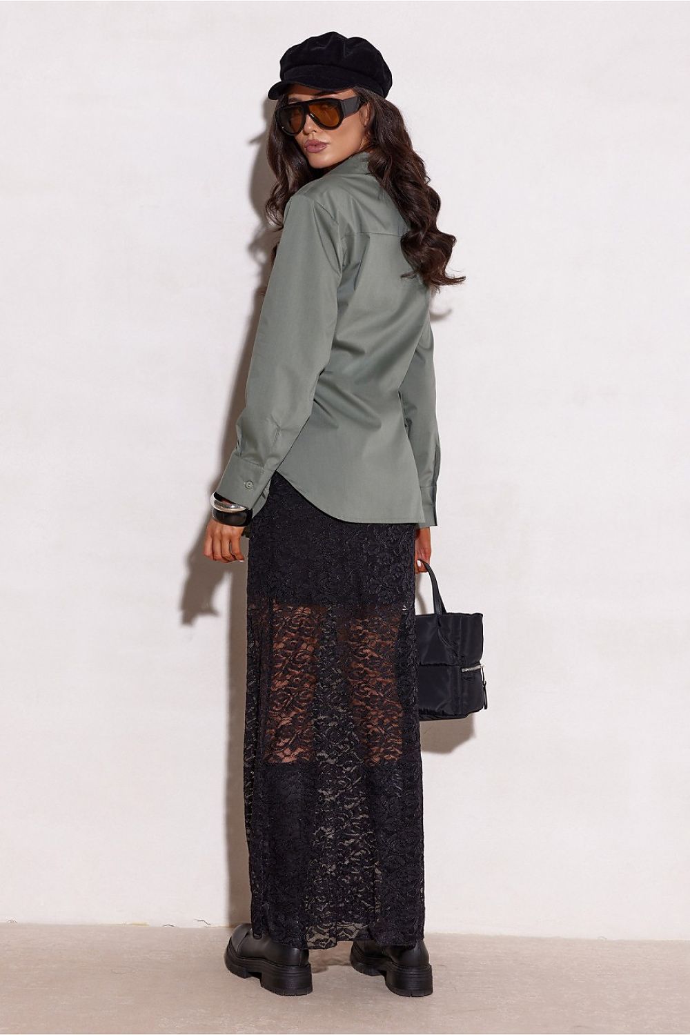 Model wearing Roco Fashion's elegant long sleeve shirt paired with fitted trousers, exemplifying a luxurious and timeless look for any occasion.