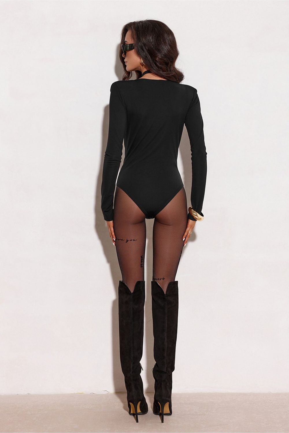 Roco Fashion's luxurious long-sleeved bodysuit, showcasing its flattering fit and romantic design elements, ideal for elegant outings and special occasions.