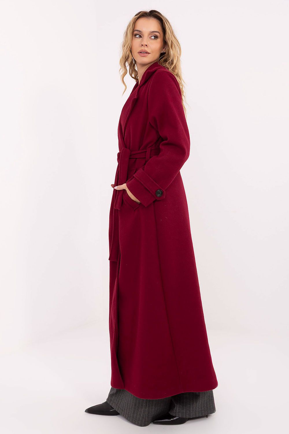 Detail shot of the waist tie belt on a luxurious women's long coat from Factory Price, designed for sophistication and comfort.