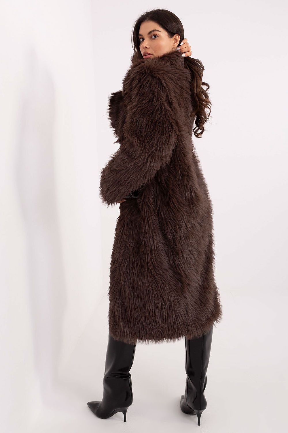 Model wearing the Elegant Women's Long Fur Coat by Factory Price, styled for a sophisticated autumn look with snap closure and practical slip pockets.