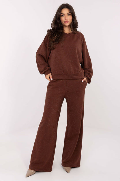 Elegant wide leg tracksuit trousers with high waist and side pockets, crafted from a soft cotton-polyester blend by Factory Price, showcasing a luxurious and modern design.